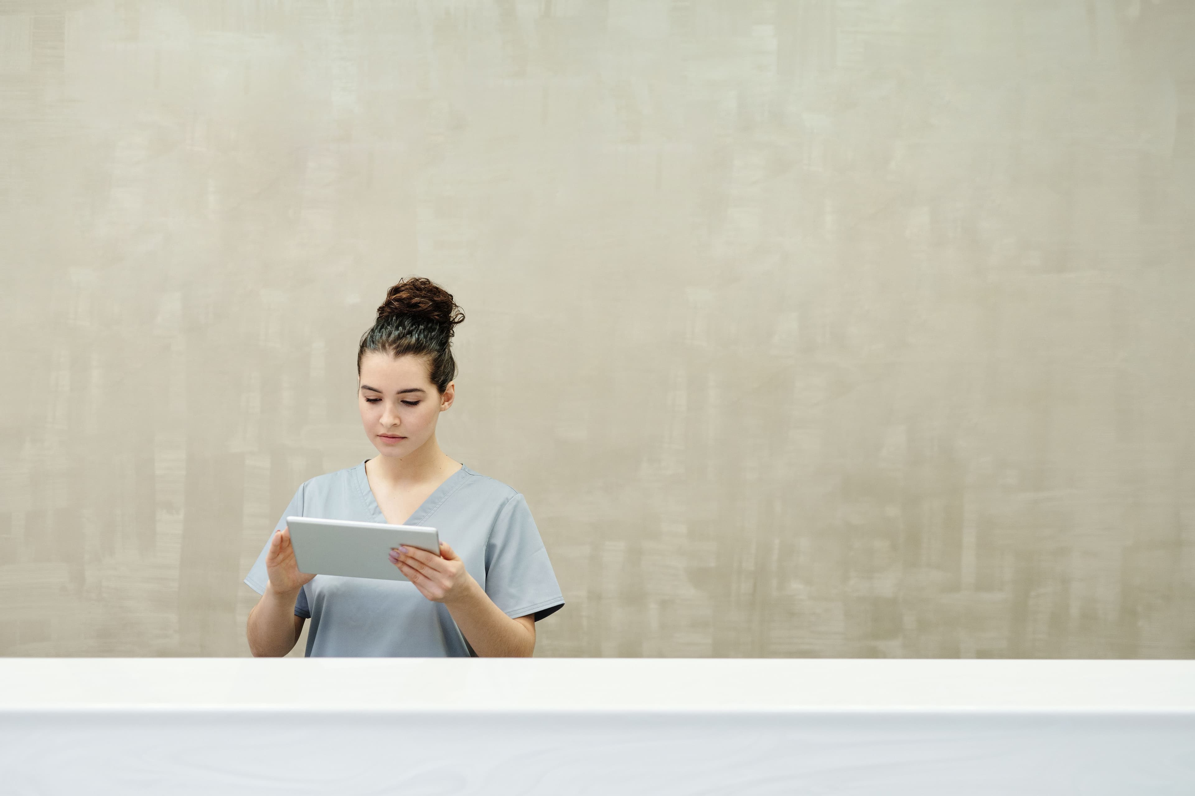 A clinic team member working at the front desk